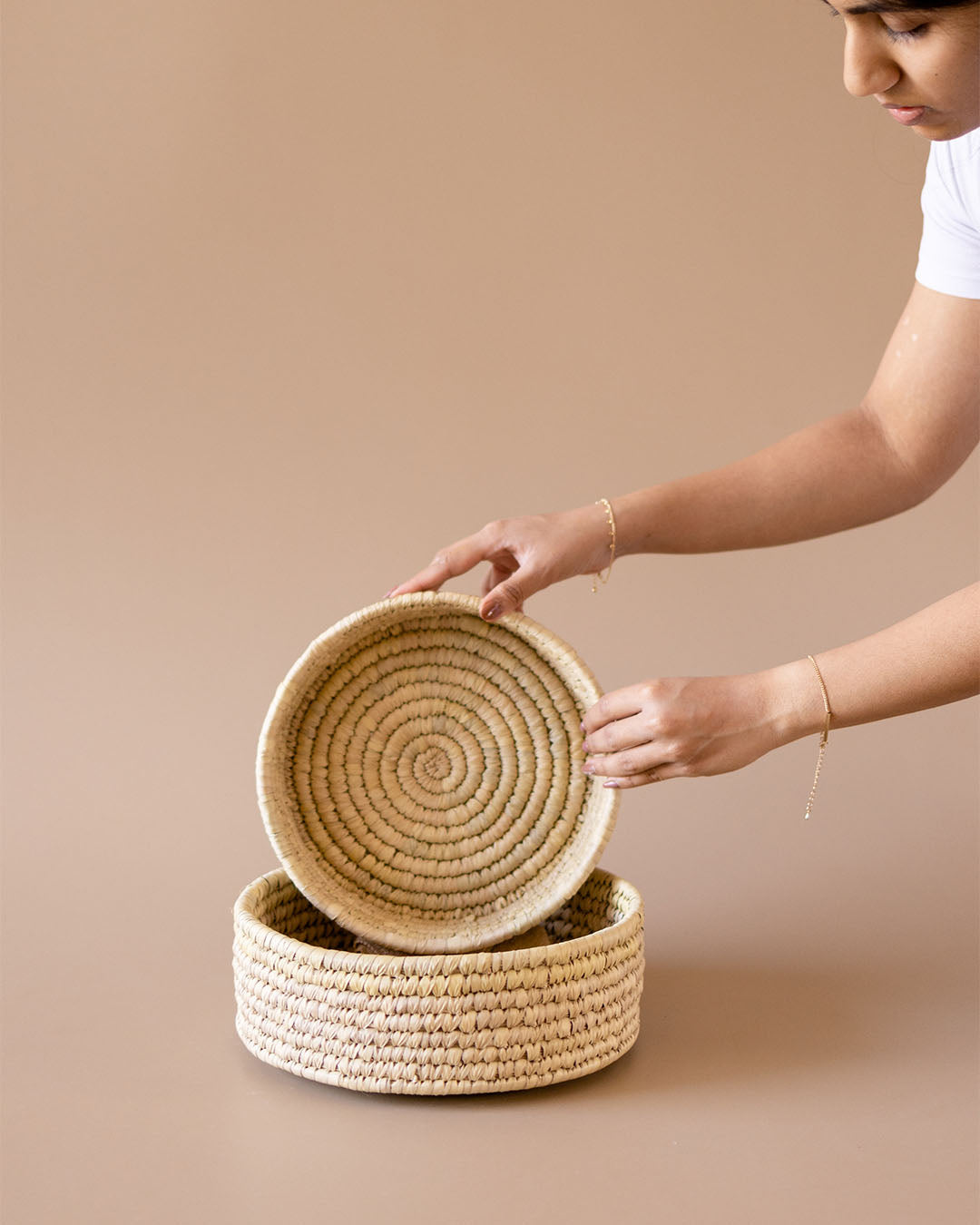 Handwoven round wicker storage basket for shelf at Kolus