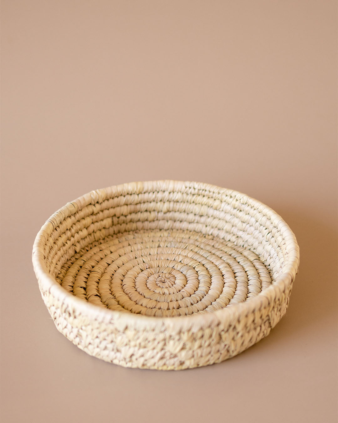 Round handmade wicker woven natural storage basket by Kolus Home
