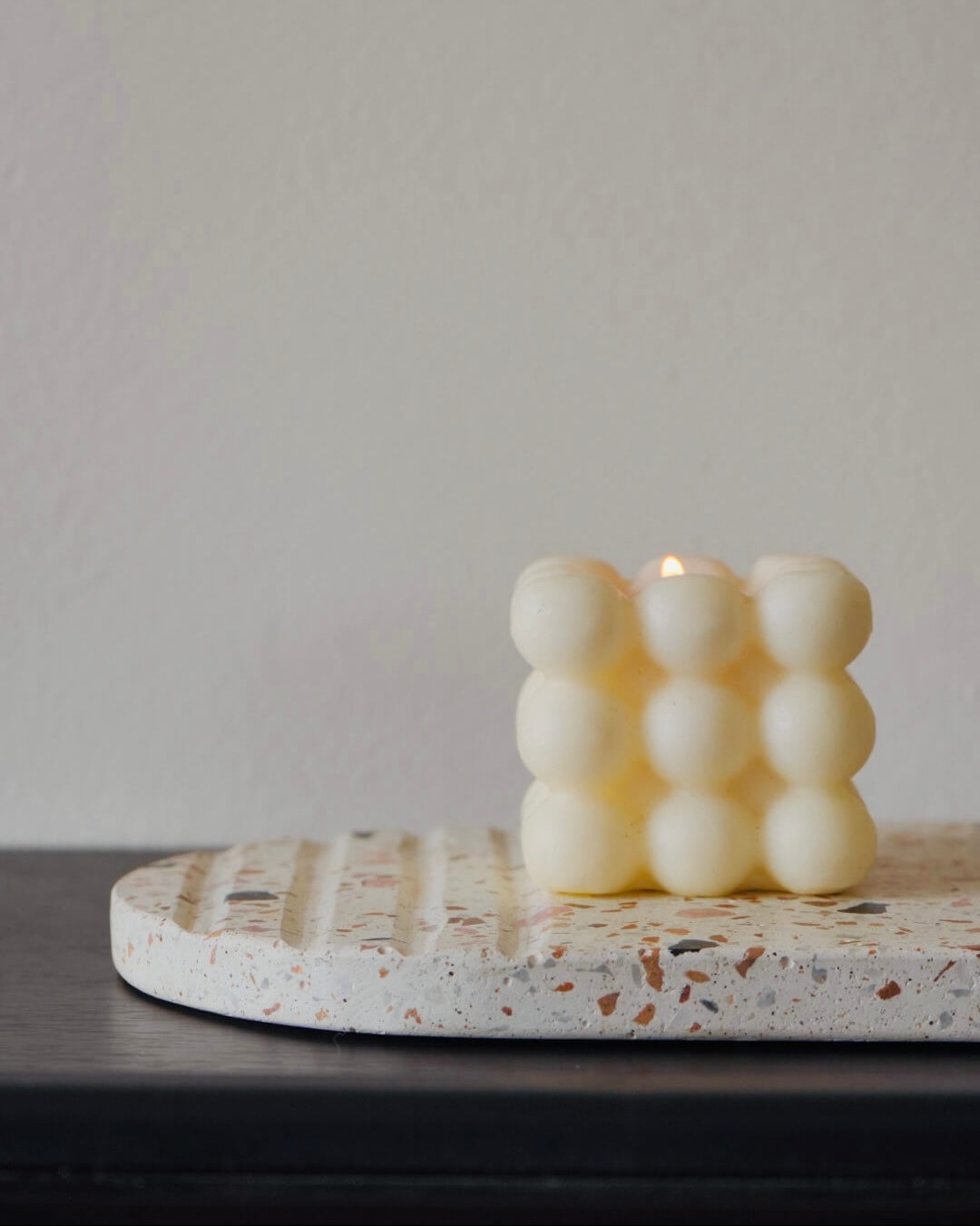 Oval White Terrazzo Trivet with bubble candle
